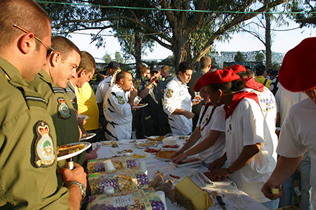 230 Squadron aircrew in-line to have a taste of Frances finest food served by the Mont-De-Marsan team during the Beja Tiger Meet International evening