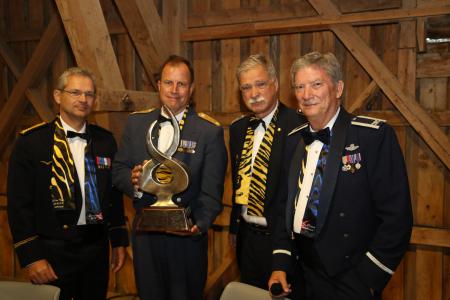 Brig. General Guttormsen receives the Tiger Spirit Award from the NTA Advisors.